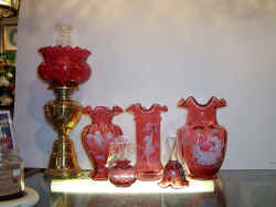 Fenton Real Cranberry made with 24k gold as made 100 years ago. White hand-painted designs, usually Victorian children at play.  