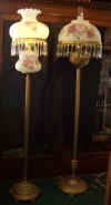 Hand Painted with 24k gold accents Floor Lamp $399.95                  Floor Lamp on right side - Another old floor lamp with 14" prism band and prisms, brass font $322.99 plus cost of shade of your choice and chimney.